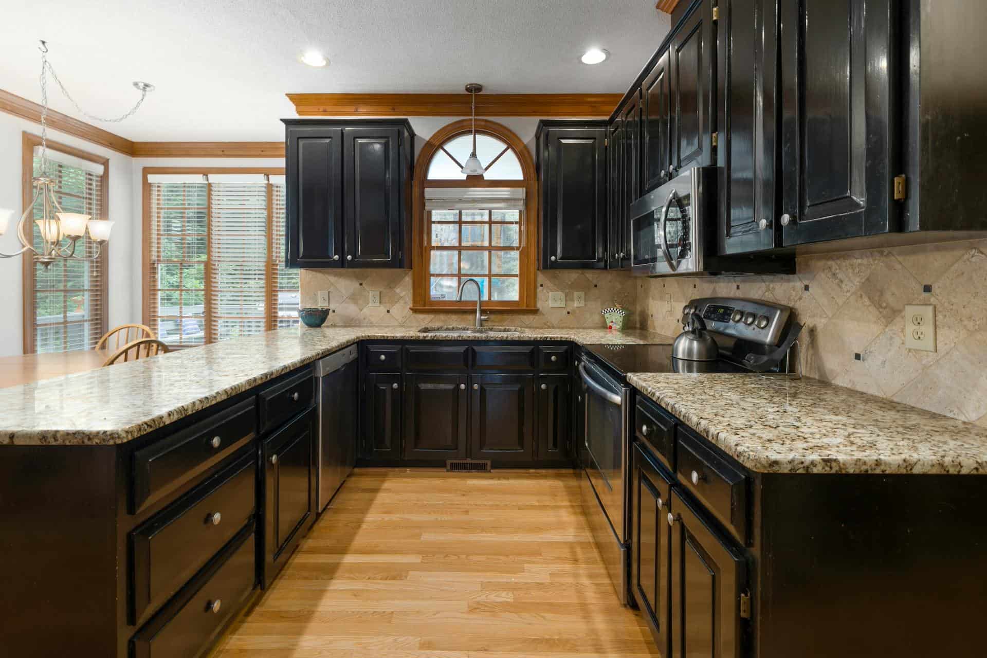 How Do You Remove Stubborn Water Spots From Dark Cabinets?